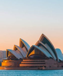 Sydney, Australia - March 18, 2018: People kayaking in the morning at Sydney Harbour with Opera House on the background.